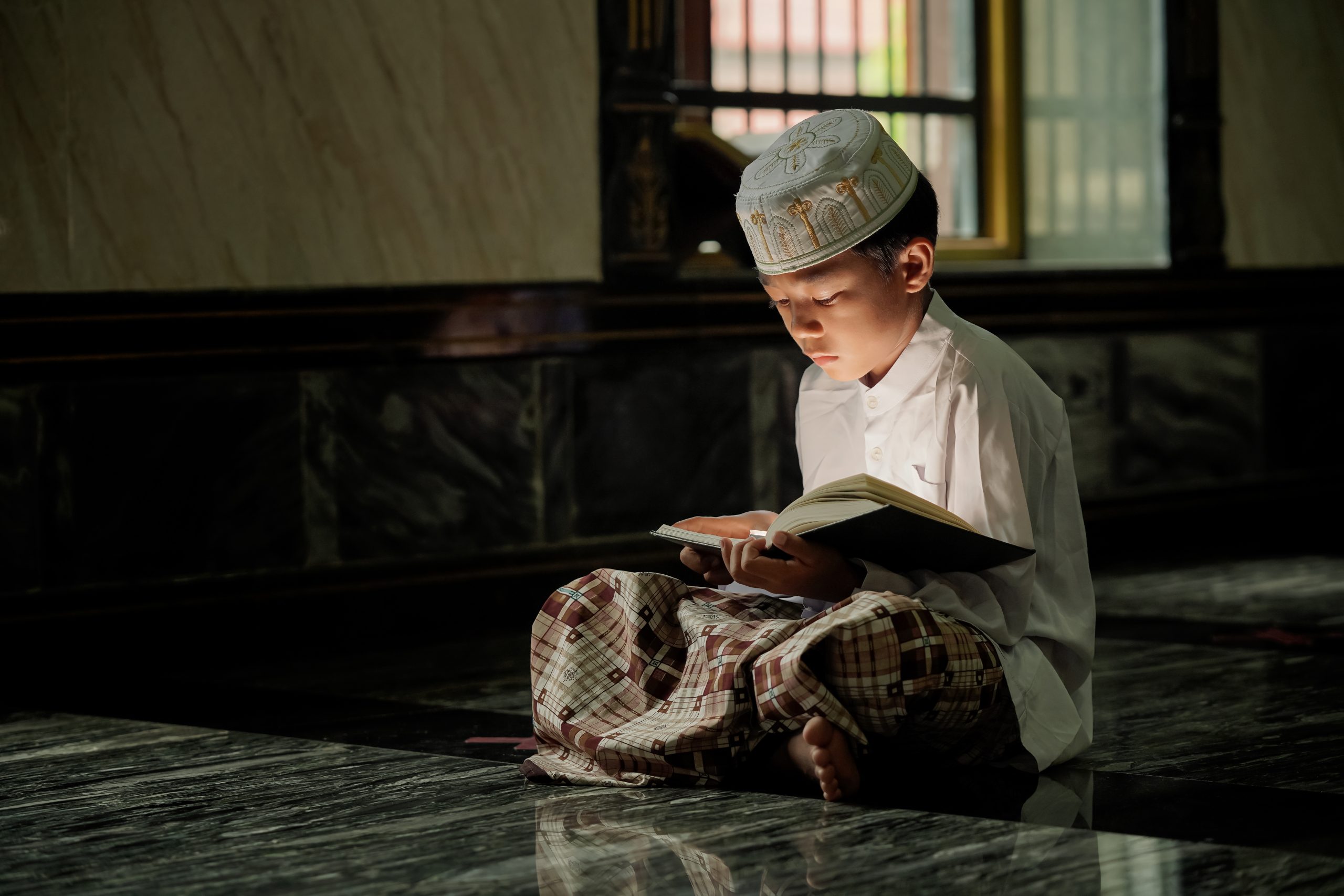 The boy learned to read the Quran from inside the mosque, a concept of the next generation of Islam.